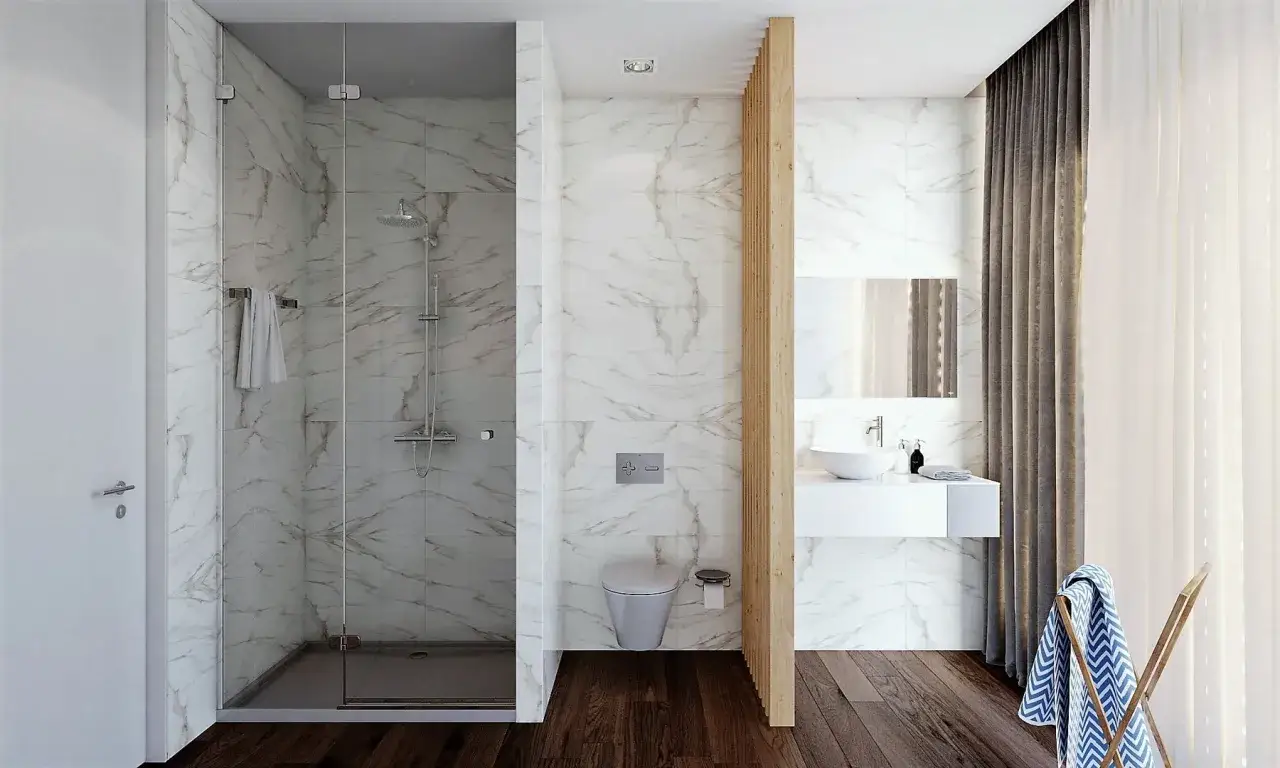 Baño moderno con ducha de suelo continuo, lavabo flotante y cortinas elegantes.